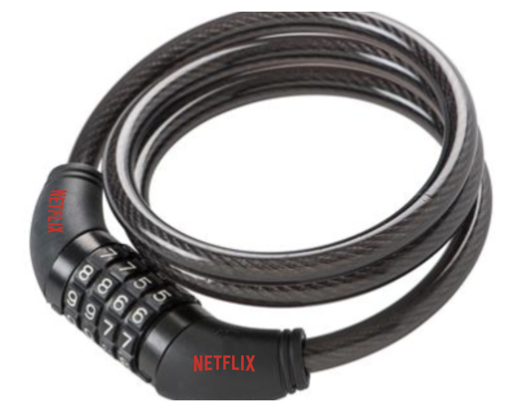 A coiled bike lock with a combination dial, featuring branded elements and predominantly black in color.