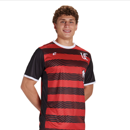 Person wearing a red and black striped sports jersey on a white background